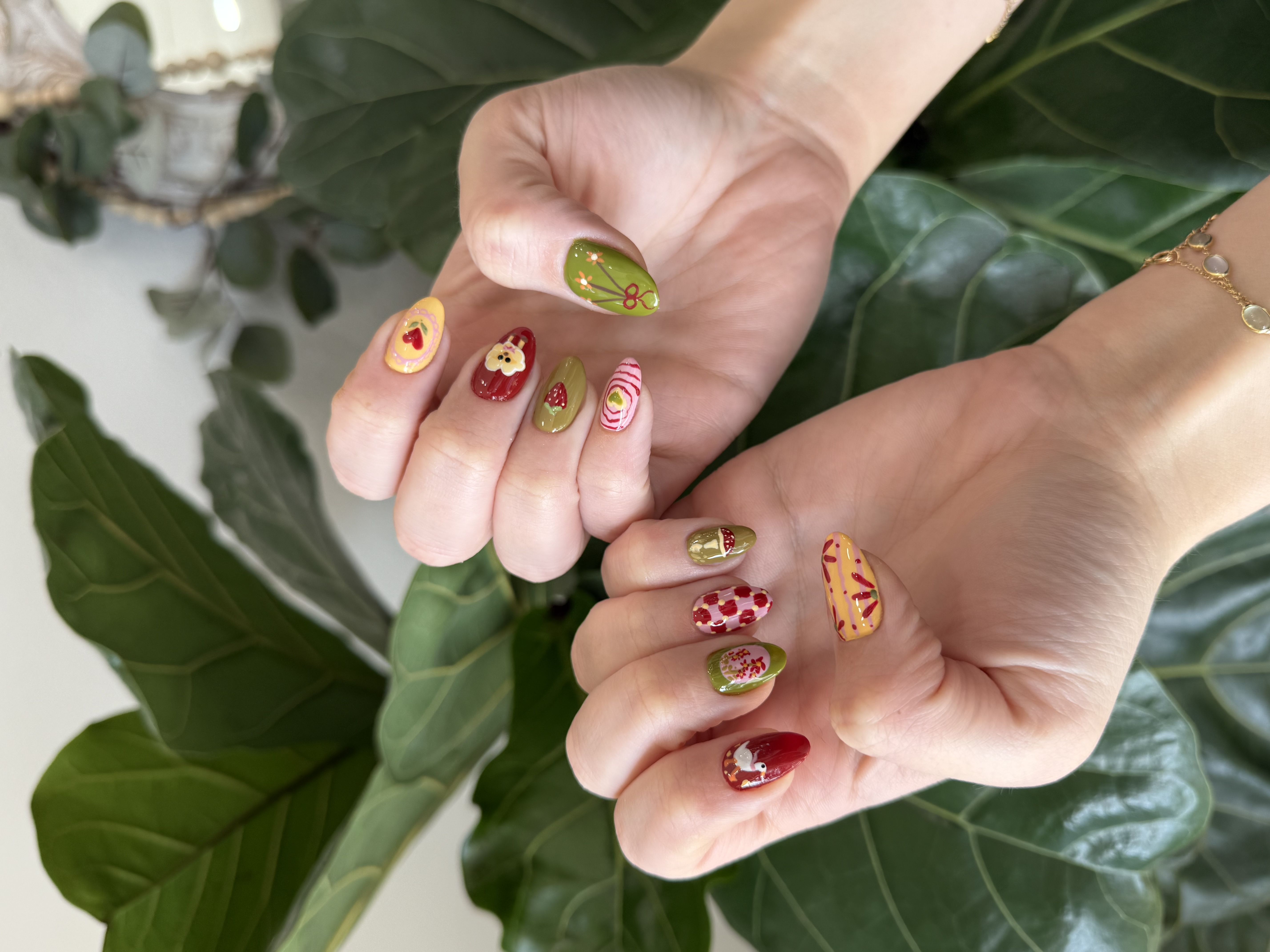 Green red cartoon character mixed custom nail art with mushroom bear bird ColorLab Nail Studio Los Angeles