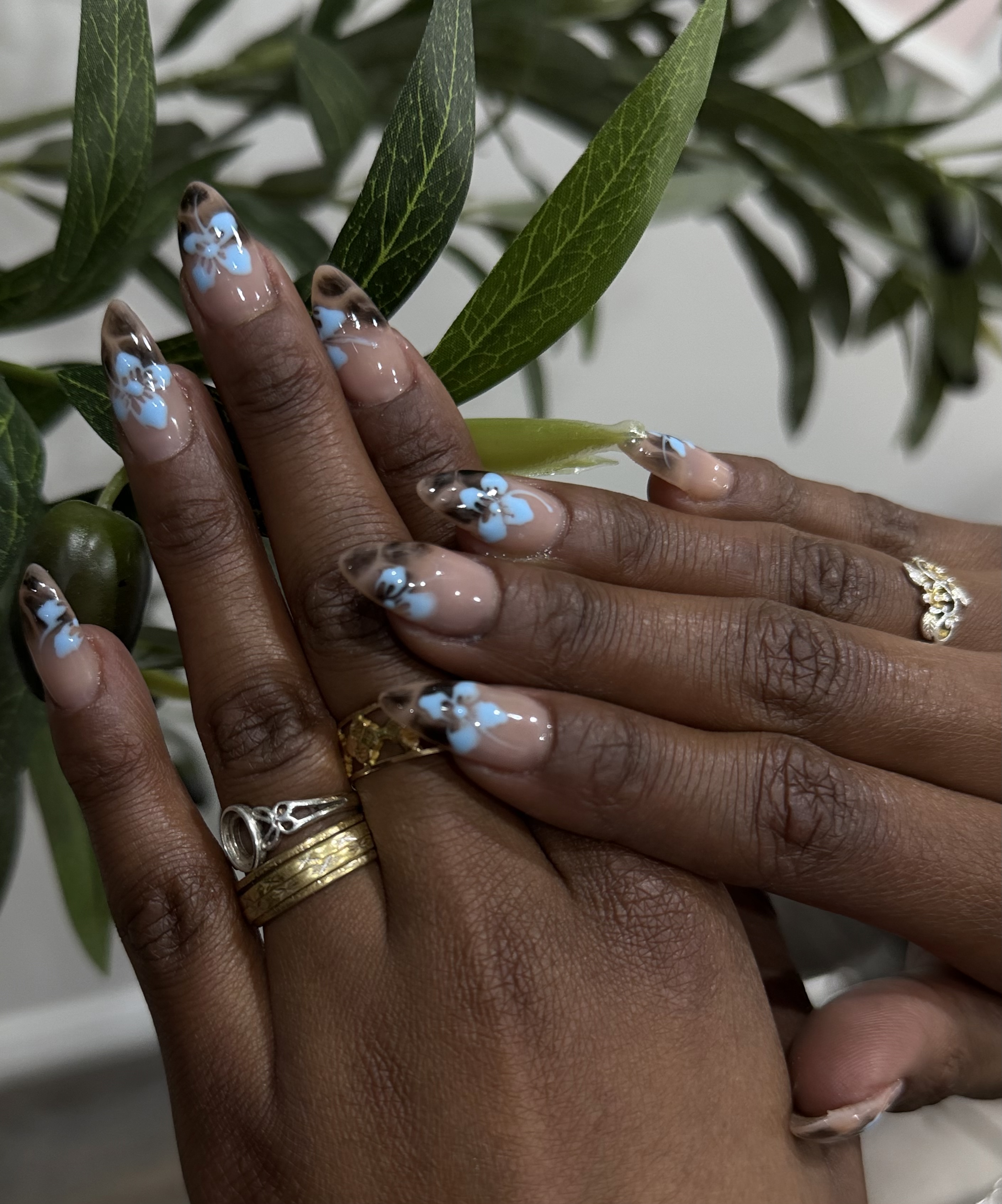 Brown blue hibiscus French tip nail art