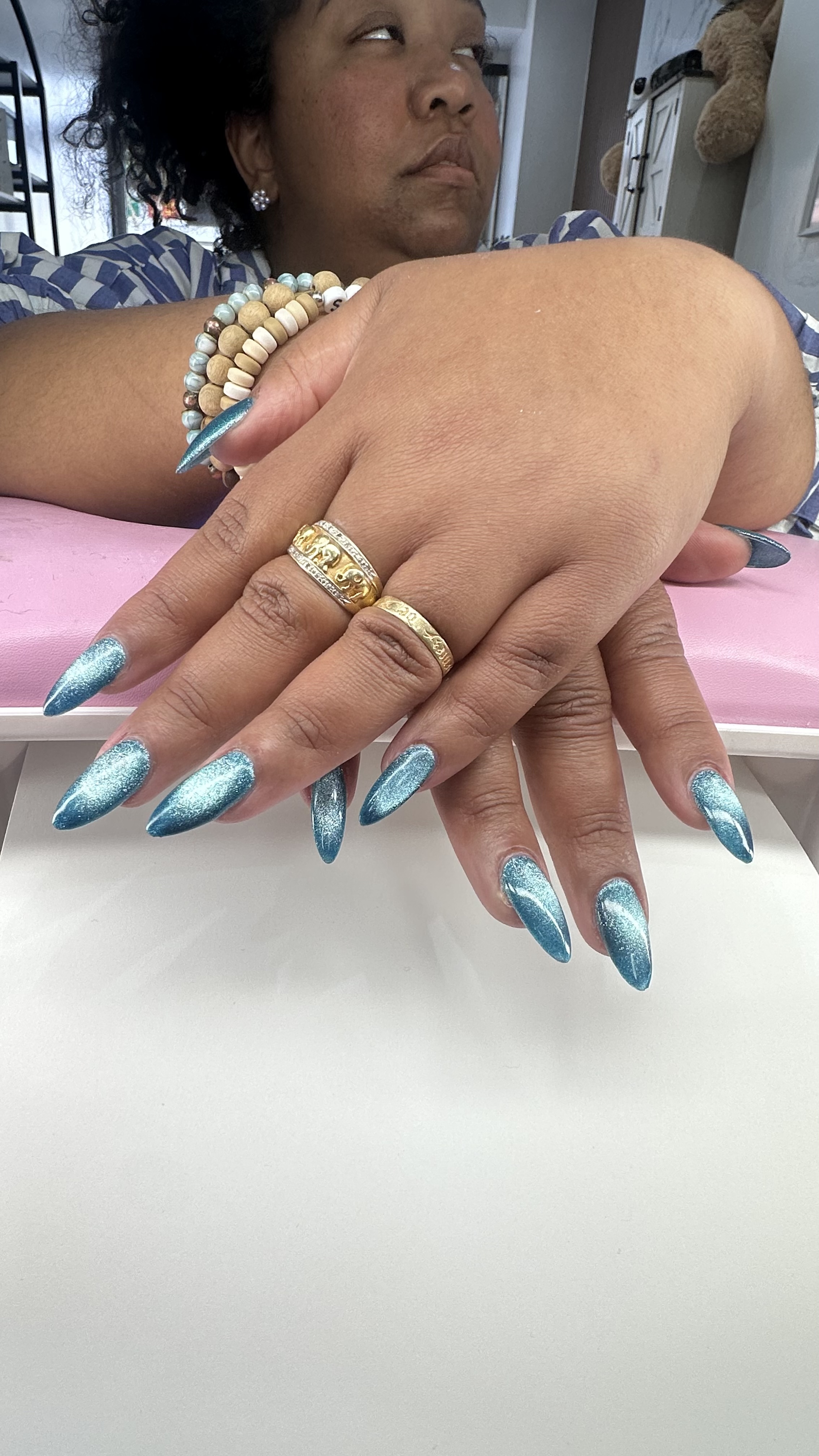 Teal cat-eye chrome stiletto nail art